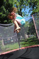 Image showing girl jumps on the trampoline