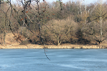 Image showing spring river with melting of ice and forest