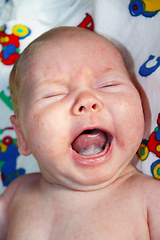 Image showing little baby crying on the bed