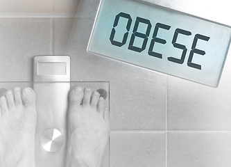 Image showing Man\'s feet on weight scale - Obese