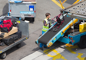 Image showing AMSTERDAM, NETHERLANDS - JUNE 29, 2017: Loading luggage in airpl