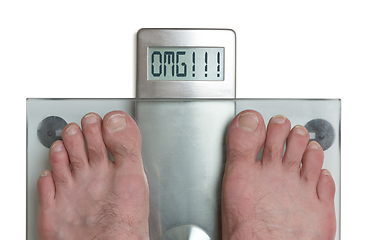 Image showing Man\'s feet on weight scale - OMG