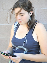 Image showing Female sending a text.