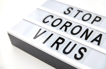 Image showing close up of lightbox with stop corona virus words