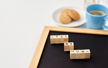 Image showing chalkboard with stay at home words on toy blocks