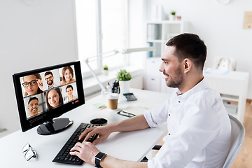 Image showing businessman has video call with partners at office