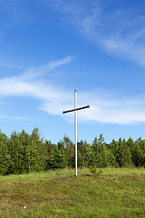 Image showing metal cross in the wood