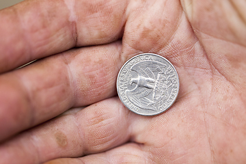 Image showing American coin in hand