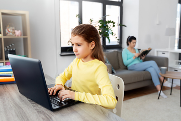 Image showing student girl with laptop learning online at home