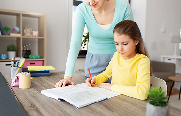 Image showing mother and daughter doing homework together