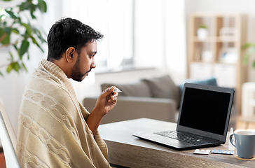 Image showing sick man thermometer having video call on laptop