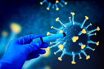 Image showing hand holding beaker with coronavirus blood test