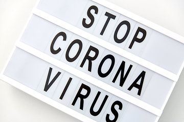 Image showing close up of lightbox with stop corona virus words