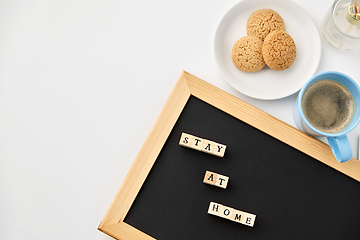 Image showing chalkboard with stay at home words on toy blocks