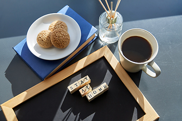 Image showing chalkboard with stay at home words on toy blocks