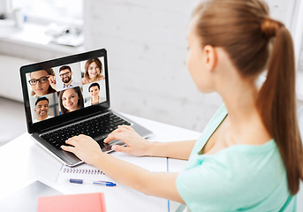Image showing woman with laptop has video call with colleagues
