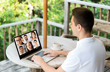 Image showing man with laptop having video call with colleagues