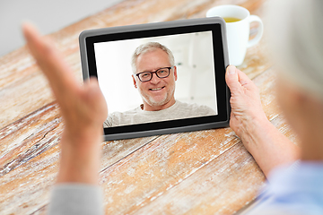 Image showing senior woman having video call with senior man