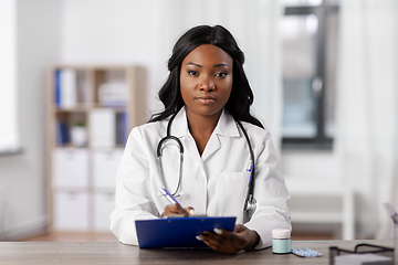 Image showing african american doctor with clipboard at hospital