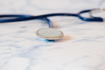 Image showing Medical stethoscope or phonendoscope over light blue background