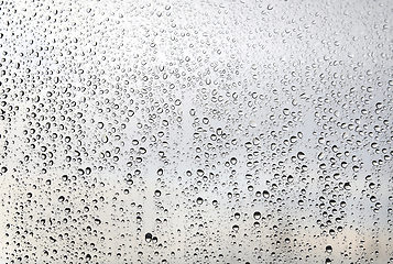 Image showing Natural water drops on glass