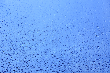 Image showing Water drops on glass, natural blue texture