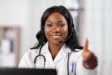 Image showing african doctor with headset and laptop at hospital