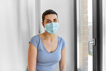 Image showing sick young woman wearing protective medical mask