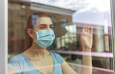 Image showing sick young woman wearing protective medical mask