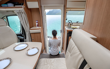 Image showing Woman in the interior of a camper RV motorhome with a cup of cof