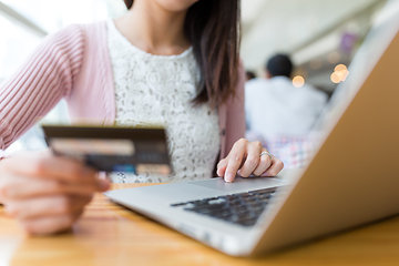 Image showing Woman shopping with credit card and laptop computer