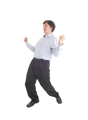 Image showing Happy young man dancing in shirt and dress pants