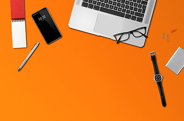 Image showing Office desk mockup top view isolated on orange
