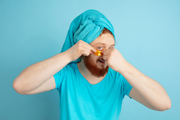 Image showing Portrait of young caucasian man in his beauty day and skin care routine