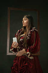 Image showing Medieval young woman in old-fashioned costume