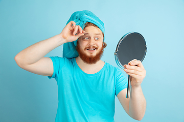 Image showing Portrait of young caucasian man in his beauty day and skin care routine