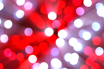 Image showing Bright blurred lights and beams holiday background