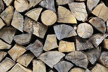 Image showing Firewood pile stacked chopped wood trunks