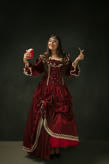 Image showing Medieval young woman in old-fashioned costume