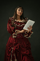 Image showing Medieval young woman in old-fashioned costume