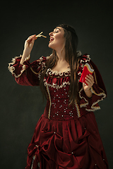 Image showing Medieval young woman in old-fashioned costume