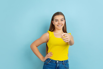 Image showing Caucasian teen girl portrait isolated on blue studio background