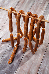 Image showing Sausages On A Wooden Table