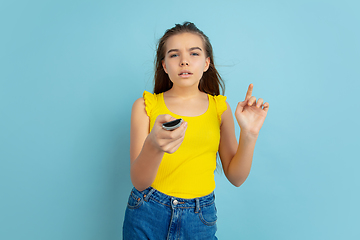 Image showing Caucasian teen girl portrait isolated on blue studio background