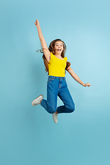 Image showing Caucasian teen girl portrait isolated on blue studio background