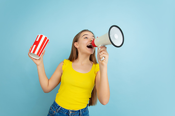 Image showing Caucasian teen girl portrait isolated on blue studio background