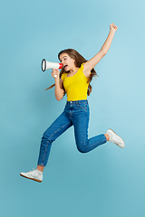 Image showing Caucasian teen girl portrait isolated on blue studio background