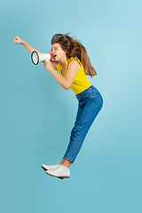 Image showing Caucasian teen girl portrait isolated on blue studio background