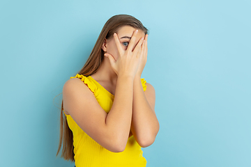 Image showing Caucasian teen girl portrait isolated on blue studio background