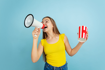 Image showing Caucasian teen girl portrait isolated on blue studio background